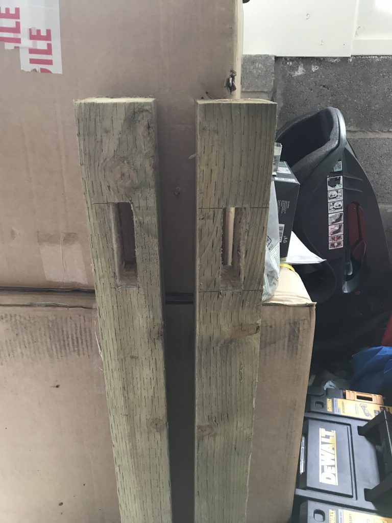 Hand cut mortices in fence posts