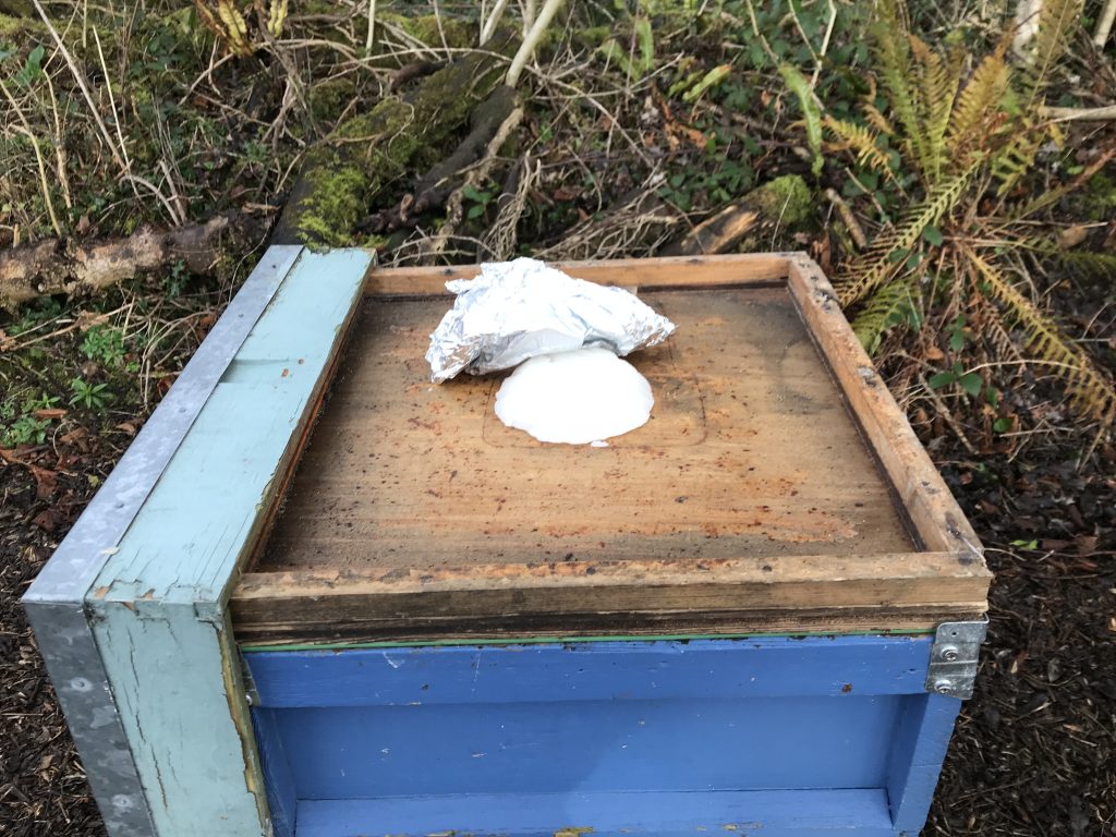 Hive with roof off and fondant on crownboard.