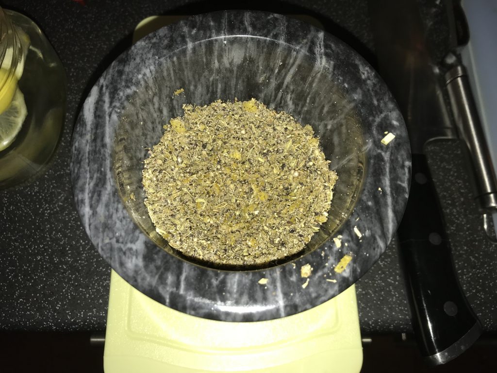 Pestle and mortar with ground lamb rub ready to use.