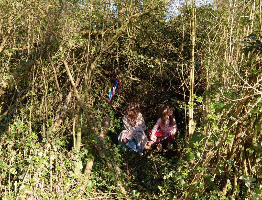 Two monsters sitting in an impromptu den