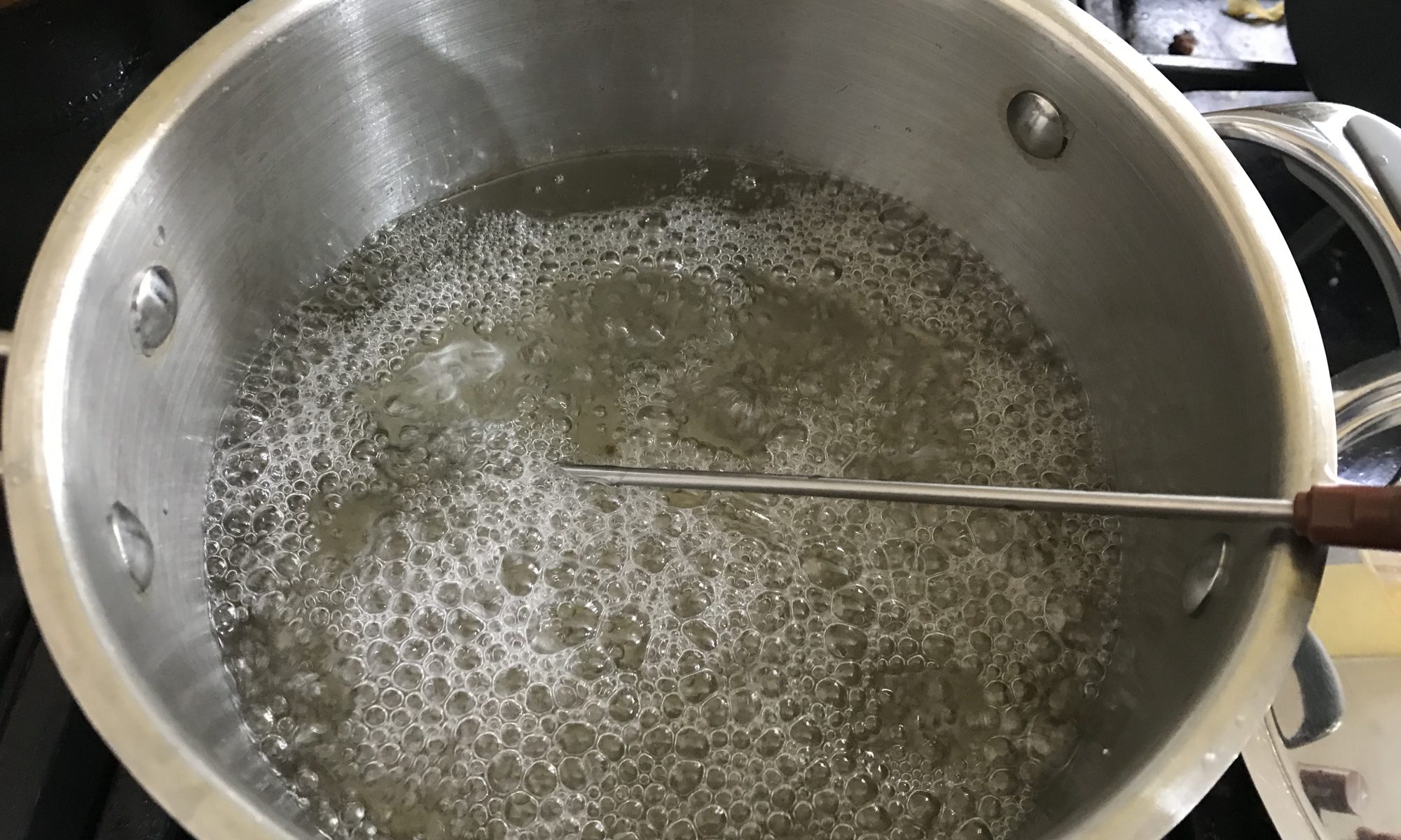 A boiling pan of sugar syrup