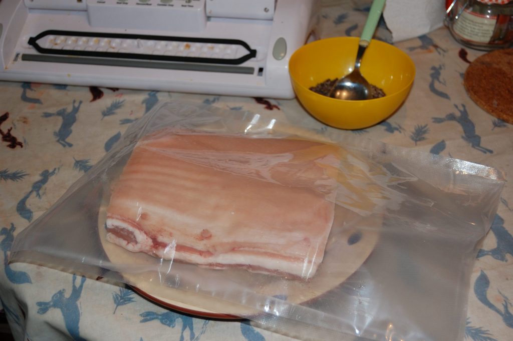 Belly pork in a vac back ready waiting for cure and sealing.