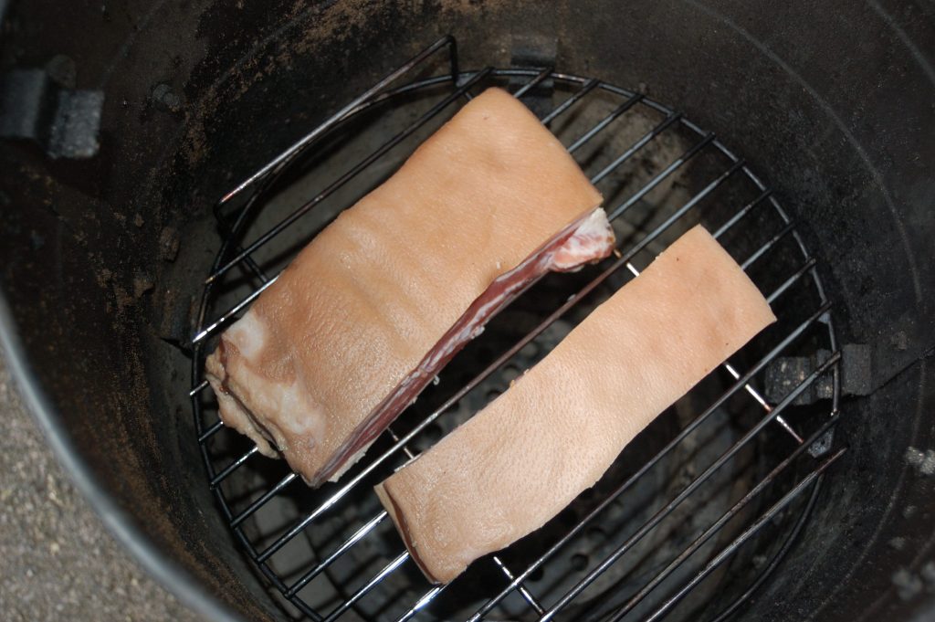 2 pieces of streaky bacon in a Callow Smoker.