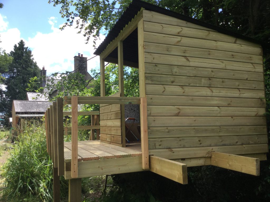 Wicked looking kids treehouse with balcony