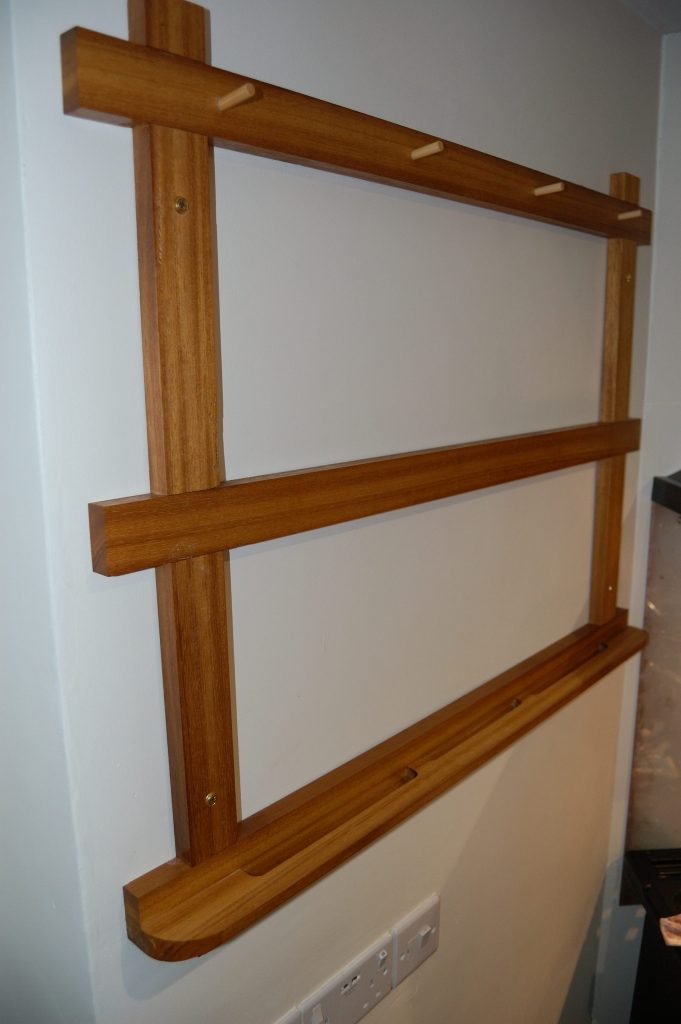 Empty pan rack on the wall.