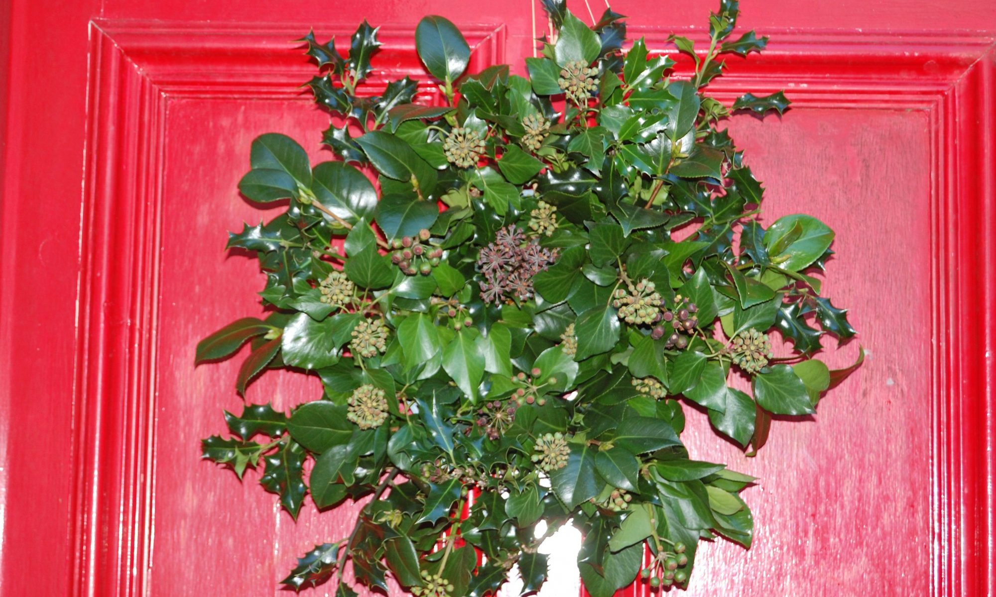 A close up of a home made door wreath for Christmas