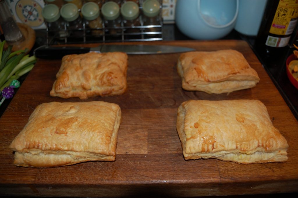 Four nicely browned pumkin pasties.