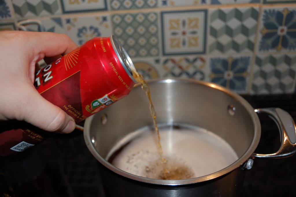 Pouring 3 pints into a saucepan.