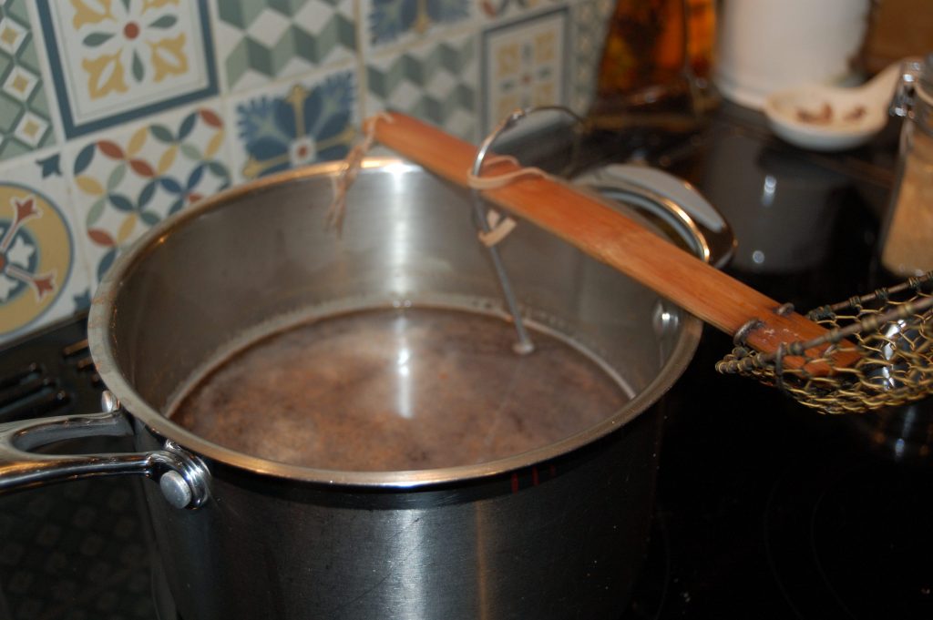 A madman heating beer.