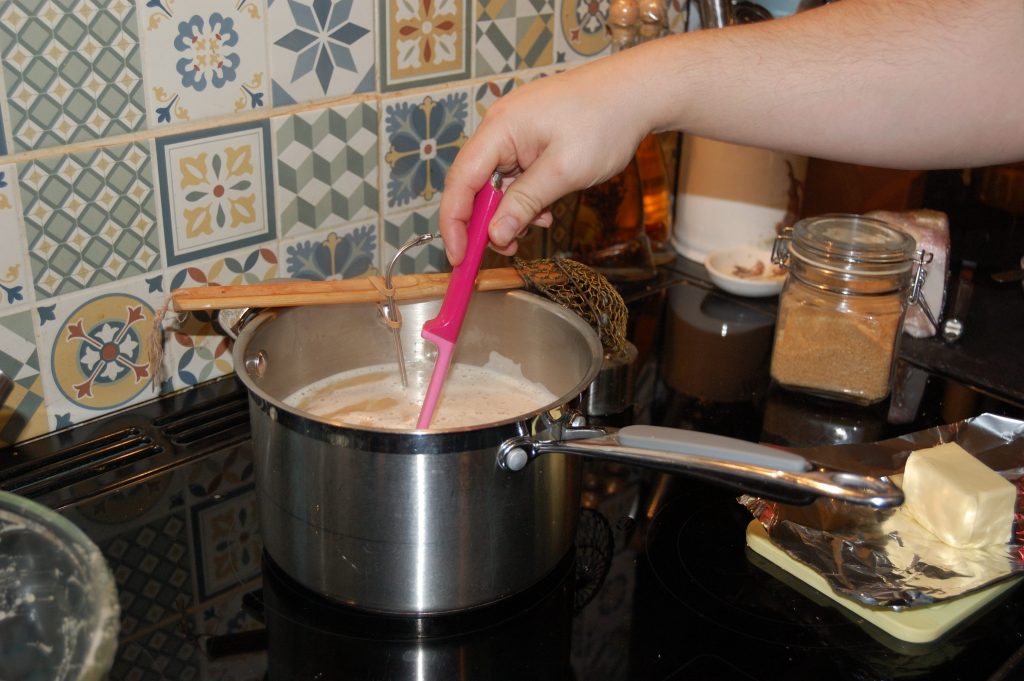 Heating the beer and eggs mix.