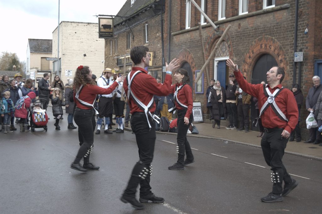 Red and black clothed dancers of Clausentum Morris throwing stick claustenum.weebly.com